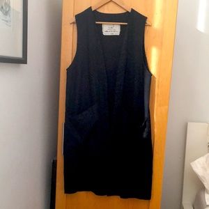 Long linen vest with large pockets.